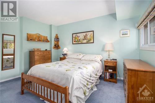 The cozy carpeting underfoot adds an extra layer of warmth and comfort, making this room the perfect retreat for relaxation. - 4629 Carrington Place, Ottawa, ON - Indoor Photo Showing Bedroom