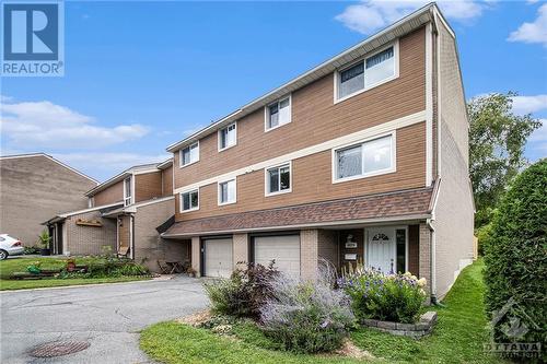 The attached garage offers secure, sheltered parking, protecting your vehicle from the elements and providing direct access to the home—perfect for bringing in groceries or avoiding bad weather. A - 4629 Carrington Place, Ottawa, ON - Outdoor