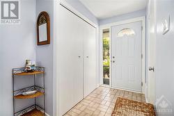 Step into a welcoming front hall featuring clean, stylish tiles that offer both durability and easy maintenance. The bright and open entryway sets the tone for the rest of the home and provides im - 