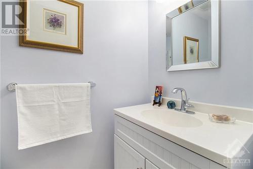 Thoughtfully designed, this powder room features a sleek, one-piece countertop that combines both style and ease of maintenance. - 4629 Carrington Place, Ottawa, ON - Indoor Photo Showing Bathroom