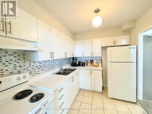 1003 - 3390 Weston Road, Toronto, ON - Indoor Photo Showing Kitchen With Double Sink