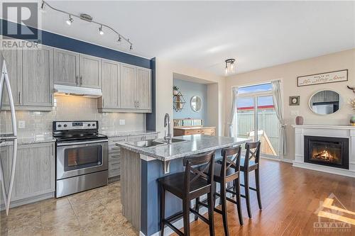 200 Don Brown Private, Ottawa, ON - Indoor Photo Showing Kitchen With Fireplace With Stainless Steel Kitchen With Double Sink