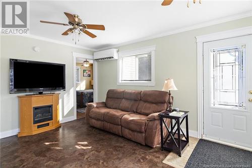 38 Summit Drive, Minto, NB - Indoor Photo Showing Living Room With Fireplace