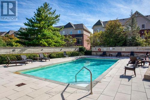 906 - 2391 Central Park Drive, Oakville, ON - Outdoor With In Ground Pool With Backyard