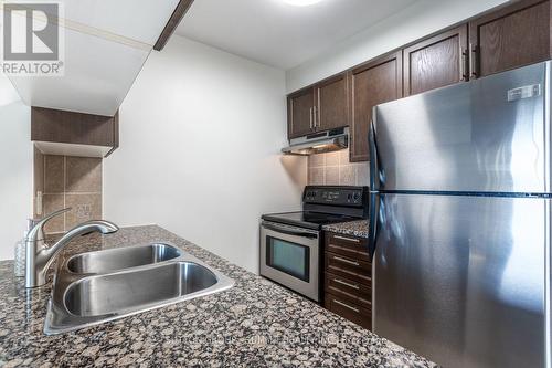 906 - 2391 Central Park Drive, Oakville, ON - Indoor Photo Showing Kitchen With Double Sink