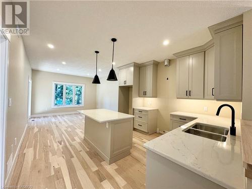 Eat-in kitchen with walkout to deck - 15 Nyah Court, Tiverton, ON - Indoor Photo Showing Kitchen With Double Sink With Upgraded Kitchen