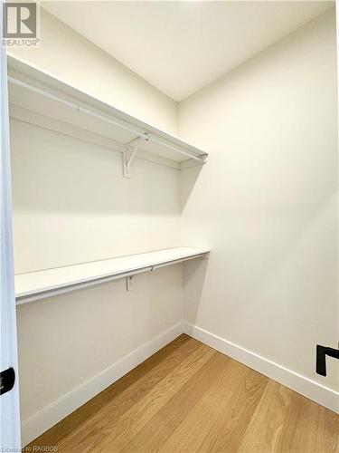 Walk in closet in the primary bedroom 2 of 2 - 11 Nyah Court, Tiverton, ON - Indoor With Storage