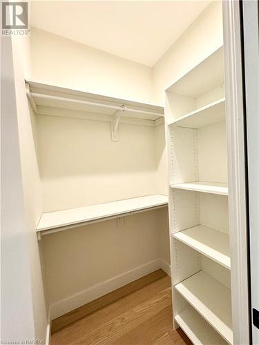 Walk in closet in the primary bedroom 1 of 2 - 11 Nyah Court, Tiverton, ON - Indoor With Storage