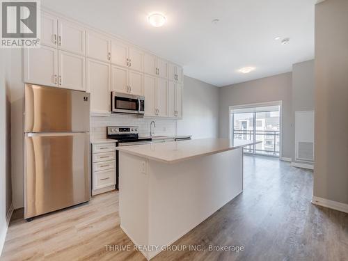 Up Graded Kitchen - 632 - 102 Grovewood Common, Oakville, ON - Indoor Photo Showing Kitchen With Stainless Steel Kitchen