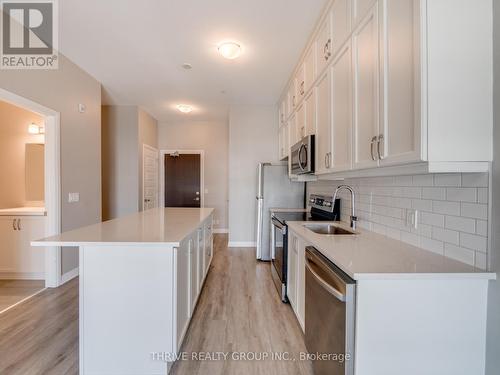 Large Prep Island - 632 - 102 Grovewood Common, Oakville, ON - Indoor Photo Showing Kitchen