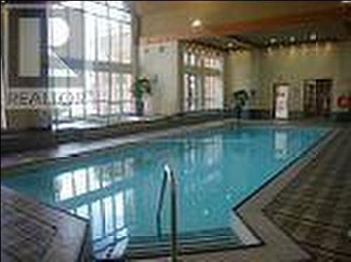 711 - 4080 Living Arts Drive, Mississauga, ON - Indoor Photo Showing Other Room With In Ground Pool