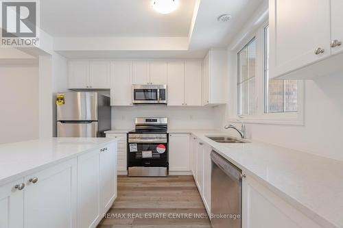 75 - 1317 Leriche Way E, Milton, ON - Indoor Photo Showing Kitchen With Stainless Steel Kitchen With Double Sink With Upgraded Kitchen