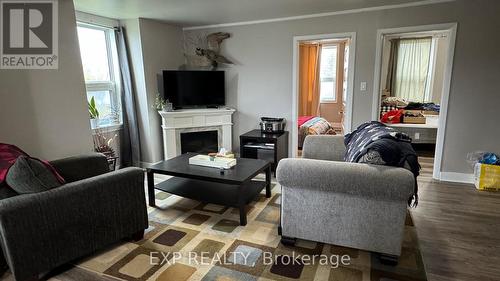 206 Eleventh Avenue, Cochrane, ON - Indoor Photo Showing Living Room With Fireplace