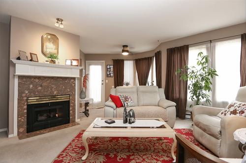 106-46000 First Avenue, Out Of Area, BC - Indoor Photo Showing Living Room With Fireplace