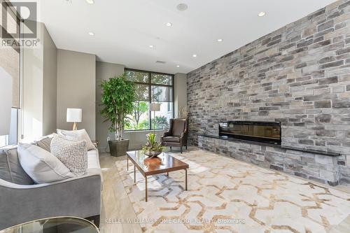 708 - 160 Macdonell Street, Guelph, ON - Indoor Photo Showing Living Room With Fireplace