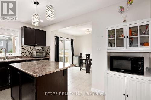 31 Tompkins Court, Norwich (Norwich Town), ON - Indoor Photo Showing Kitchen With Double Sink