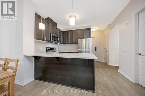 313 - 470 Gordon Krantz Avenue, Milton, ON - Indoor Photo Showing Kitchen With Upgraded Kitchen