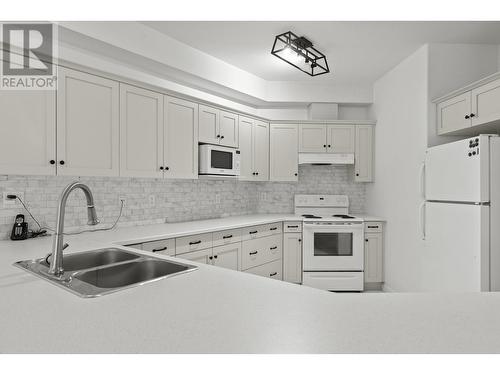 1905 Pandosy Street Unit# 101, Kelowna, BC - Indoor Photo Showing Kitchen With Double Sink