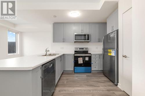 204 - 160 Densmore Road, Cobourg, ON - Indoor Photo Showing Kitchen With Double Sink