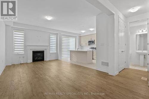 1689 Whitlock Avenue, Milton, ON - Indoor Photo Showing Living Room With Fireplace