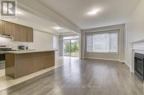 109 Huntingford Trail, Woodstock, ON - Indoor Photo Showing Kitchen With Fireplace