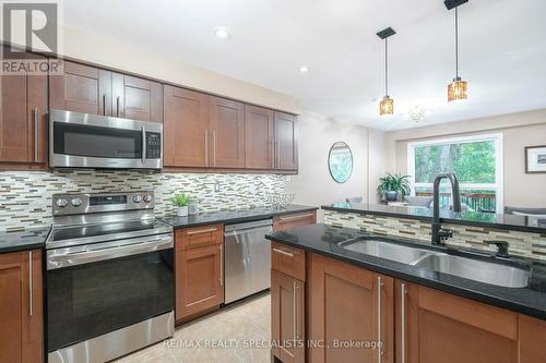 23 - 8305 Mclaughlin Road, Brampton, ON - Indoor Photo Showing Kitchen With Double Sink