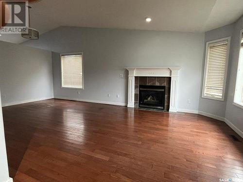 235 Beerling Crescent, Saskatoon, SK - Indoor Photo Showing Living Room With Fireplace