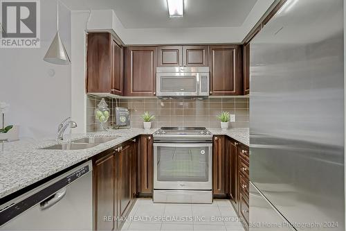 117 - 50 Via Rosedale, Brampton, ON - Indoor Photo Showing Kitchen With Double Sink