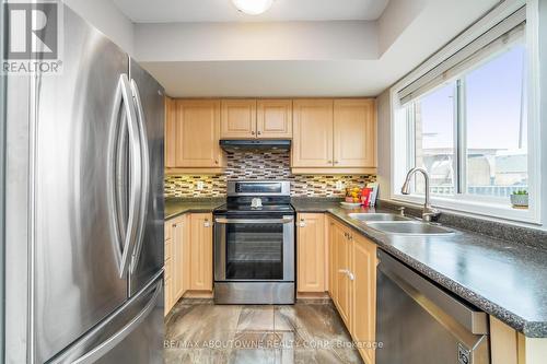 49 - 1489 Heritage Way, Oakville, ON - Indoor Photo Showing Kitchen With Double Sink