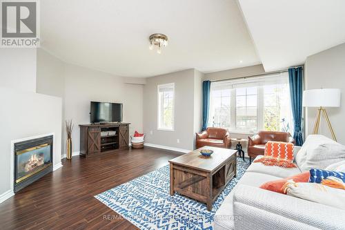 49 - 1489 Heritage Way, Oakville, ON - Indoor Photo Showing Living Room With Fireplace