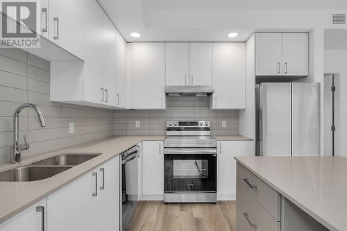 1057 Frost Road Unit# 402, Kelowna, BC - Indoor Photo Showing Kitchen With Stainless Steel Kitchen With Double Sink With Upgraded Kitchen