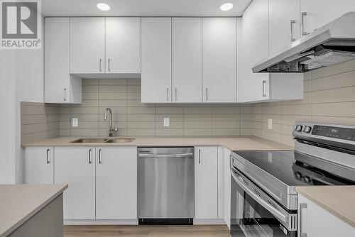 1057 Frost Road Unit# 402, Kelowna, BC - Indoor Photo Showing Kitchen With Stainless Steel Kitchen With Double Sink