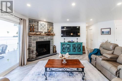 1144 North Bay Drive, Kawartha Lakes, ON - Indoor Photo Showing Living Room With Fireplace