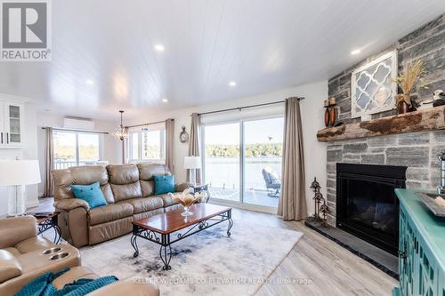 1144 North Bay Drive, Kawartha Lakes, ON - Indoor Photo Showing Living Room With Fireplace