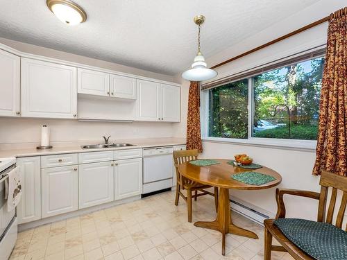 102-9993 Fourth St, Sidney, BC - Indoor Photo Showing Kitchen With Double Sink