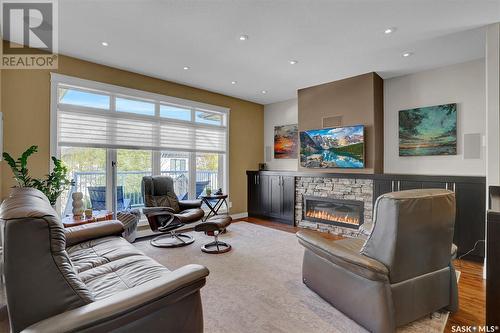 4411 Sandpiper Crescent E, Regina, SK - Indoor Photo Showing Living Room With Fireplace