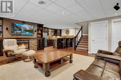 4411 Sandpiper Crescent E, Regina, SK - Indoor Photo Showing Living Room With Fireplace