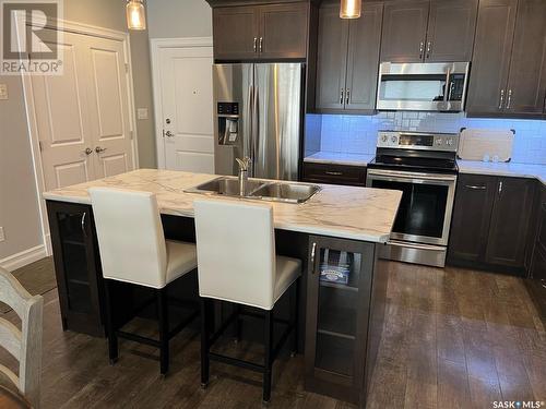 103 2800 Lakeview Drive, Prince Albert, SK - Indoor Photo Showing Kitchen With Stainless Steel Kitchen With Double Sink