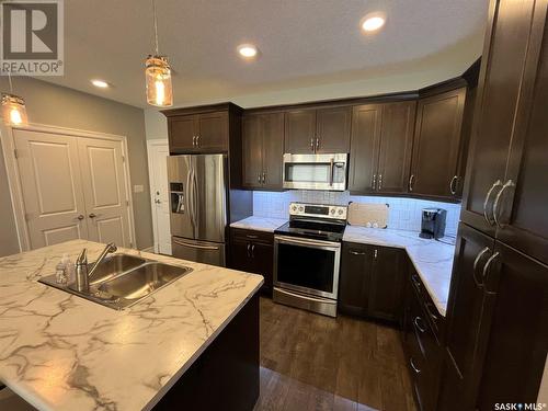 103 2800 Lakeview Drive, Prince Albert, SK - Indoor Photo Showing Kitchen With Stainless Steel Kitchen With Double Sink