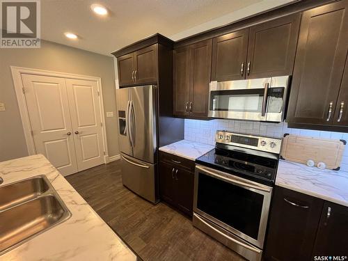 103 2800 Lakeview Drive, Prince Albert, SK - Indoor Photo Showing Kitchen With Stainless Steel Kitchen With Double Sink