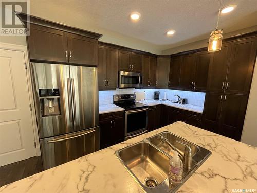 103 2800 Lakeview Drive, Prince Albert, SK - Indoor Photo Showing Kitchen With Double Sink