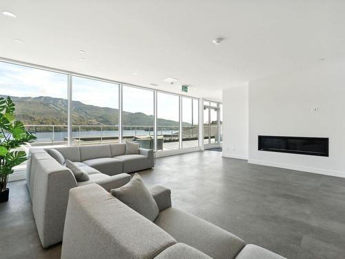 Salle communautaire - 602-121 Rue Cuttle, Mont-Tremblant, QC - Indoor Photo Showing Living Room With Fireplace