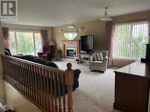 5123 42 Street Ne, Chetwynd, BC - Indoor Photo Showing Living Room With Fireplace