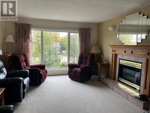 5123 42 Street Ne, Chetwynd, BC - Indoor Photo Showing Living Room With Fireplace