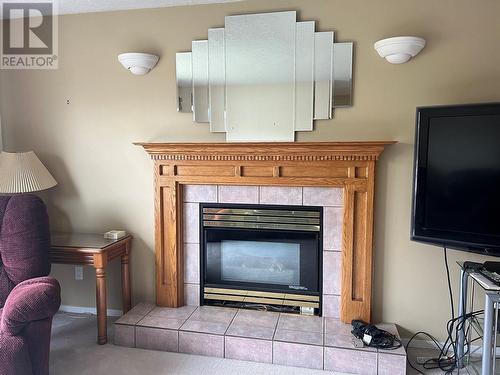 5123 42 Street Ne, Chetwynd, BC - Indoor Photo Showing Living Room With Fireplace