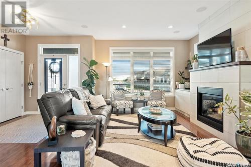 143 Maningas Bend, Saskatoon, SK - Indoor Photo Showing Living Room With Fireplace