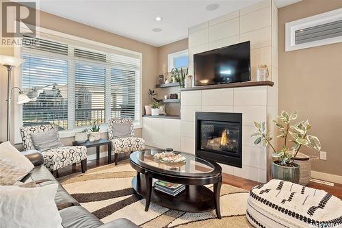 143 Maningas Bend, Saskatoon, SK - Indoor Photo Showing Living Room With Fireplace