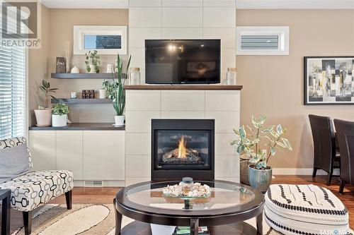 143 Maningas Bend, Saskatoon, SK - Indoor Photo Showing Living Room With Fireplace