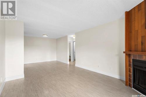 103 325 Kingsmere Boulevard, Saskatoon, SK - Indoor Photo Showing Other Room With Fireplace