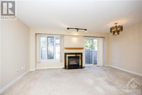 21 Grenadier Way, Ottawa, ON - Indoor Photo Showing Living Room With Fireplace